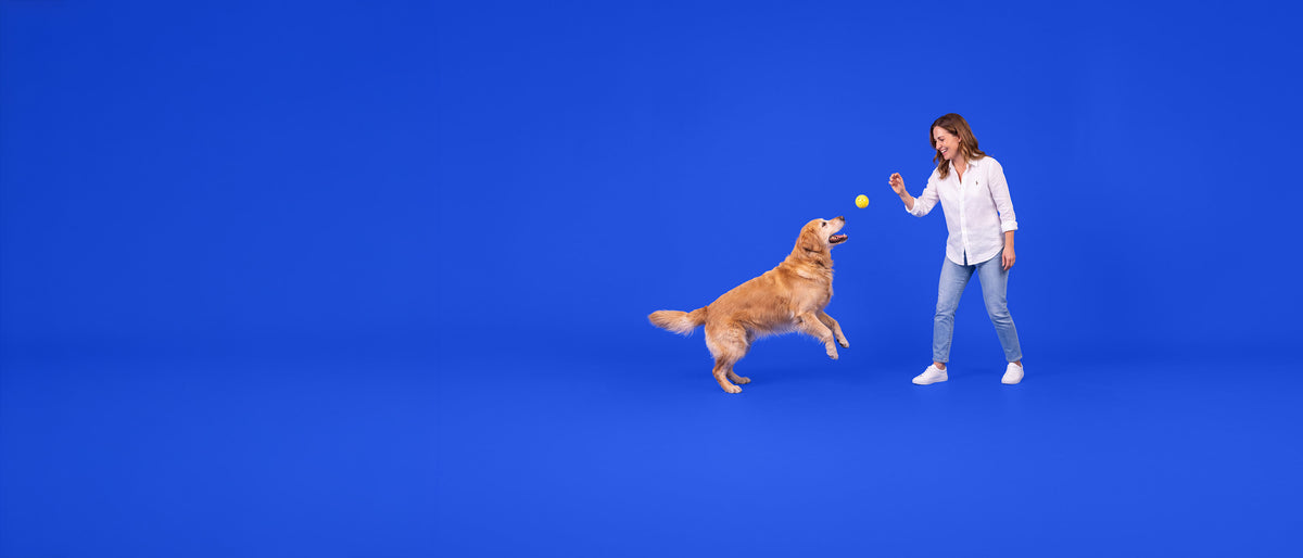 Woman playing with her dog