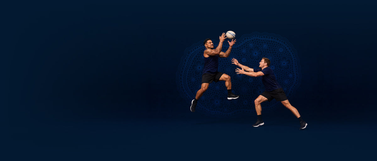 Men playing rugby